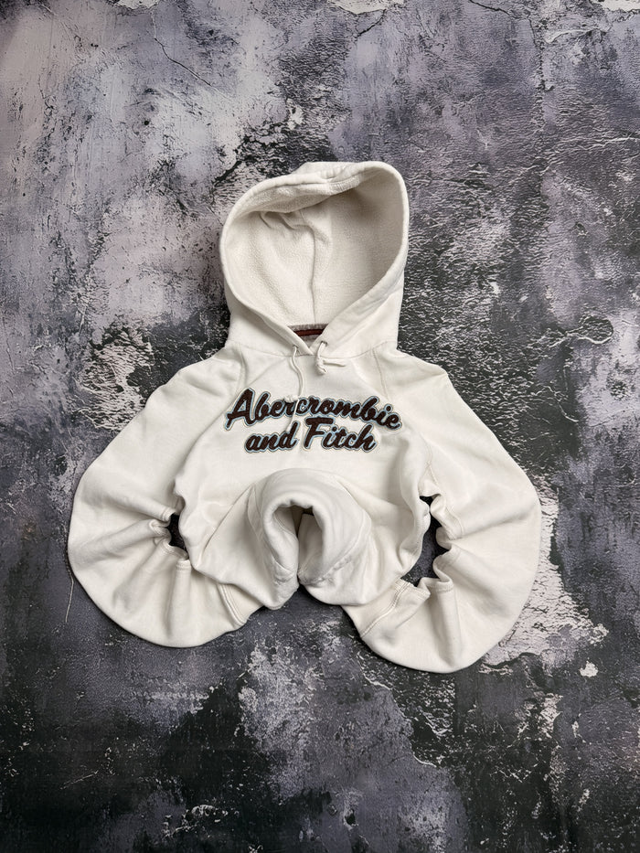 Bluza Abercrombie kremowa z kapturem i czarnym napisem